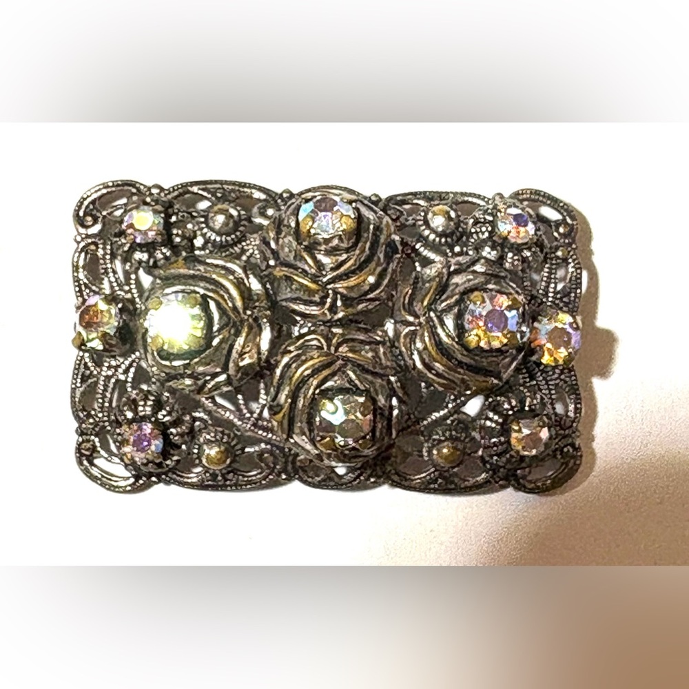Vintage Art Deco style silver filligree brooch with aurora borealis crystals